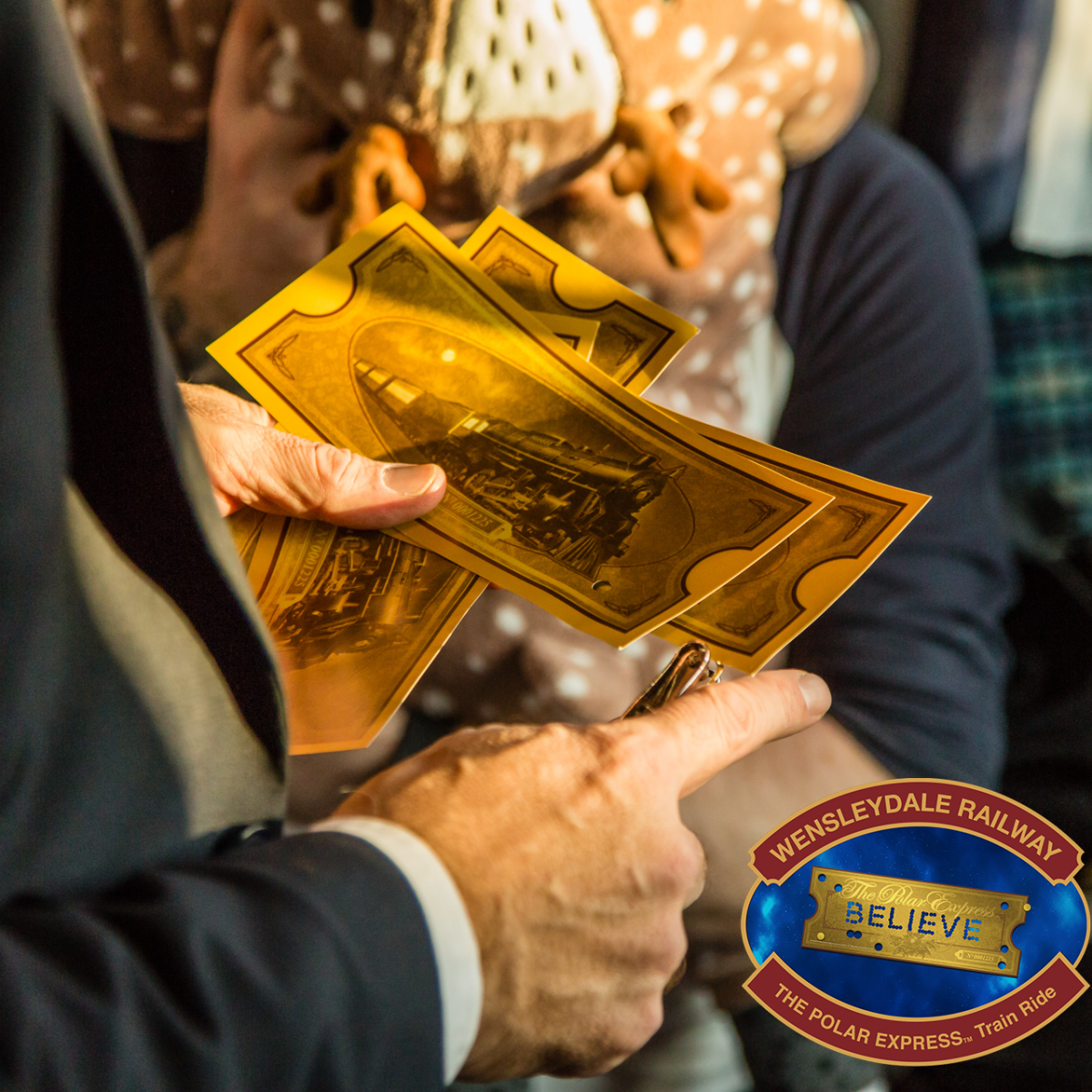 Conductor's hands punching a golden ticket.