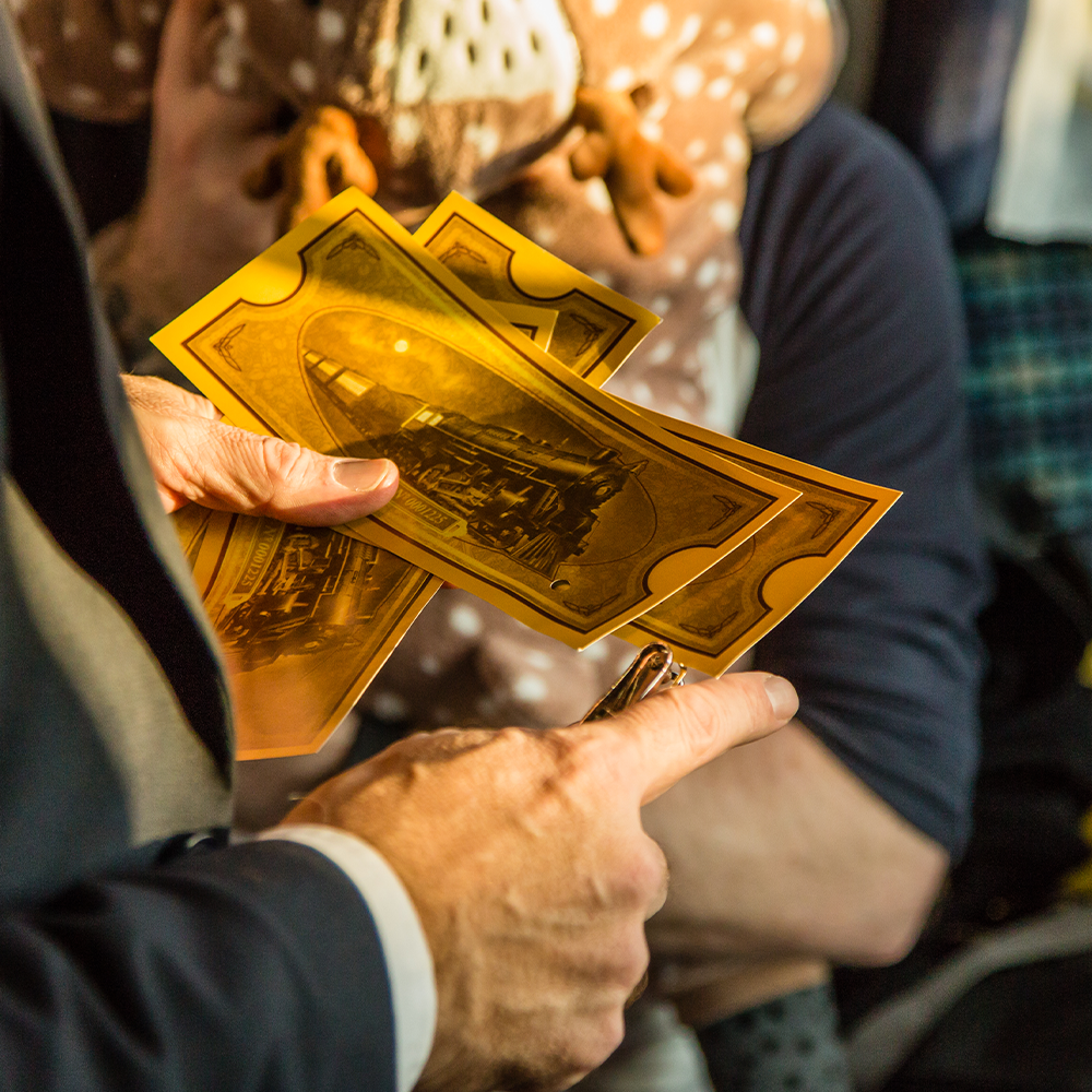 Picture of conductors hands on board the polar express train ride yorkshire